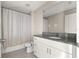 Bathroom featuring tile floors, neutral walls, a toilet, and a vanity with a granite countertop at 9209 Sw 58Th Cir, Ocala, FL 34476