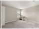 A light-filled bedroom has plush carpeting, a storage closet, and a window view at 9209 Sw 58Th Cir, Ocala, FL 34476