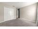 A bedroom featuring carpet floors, neutral walls, a closet, and a door leading to another room at 9209 Sw 58Th Cir, Ocala, FL 34476