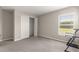 This well-lit bedroom features a storage closet and large window that allows natural light to fill the room at 9209 Sw 58Th Cir, Ocala, FL 34476