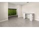 Bright flex room with sleek tile flooring, neutral walls, modern desk, and versatile layout for various uses at 9209 Sw 58Th Cir, Ocala, FL 34476