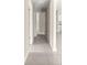 Hallway with tile flooring leads to multiple rooms at 9209 Sw 58Th Cir, Ocala, FL 34476