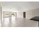 Bright and open living room featuring tile floors and access to the backyard at 9209 Sw 58Th Cir, Ocala, FL 34476