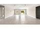 Bright living room featuring tile floors and sliding glass doors to the backyard at 9209 Sw 58Th Cir, Ocala, FL 34476