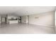Open-concept living room featuring tile flooring, kitchen, and vaulted ceilings at 9209 Sw 58Th Cir, Ocala, FL 34476