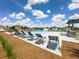 Comfortable pool loungers create a relaxing ambiance for sunbathing beside the community pool and pergola at 9209 Sw 58Th Cir, Ocala, FL 34476