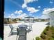 Relaxing poolside view showcases outdoor seating and lounging areas near the community pool on a sunny day at 9209 Sw 58Th Cir, Ocala, FL 34476