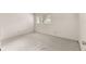 This bedroom has neutral carpet, a window, and electrical outlets at 9367 Sw 83Rd Ave # C, Ocala, FL 34481