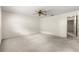 This bedroom has neutral carpet and a ceiling fan at 9367 Sw 83Rd Ave # C, Ocala, FL 34481