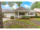 Charming single-story home with a quaint front porch and attached one car garage at 9367 Sw 83Rd Ave # C, Ocala, FL 34481