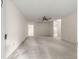Spacious living room with neutral carpet, ceiling fan, and ample natural light at 9367 Sw 83Rd Ave # C, Ocala, FL 34481