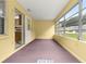 Bright enclosed sunroom with views of the yard and access to the kitchen at 9367 Sw 83Rd Ave # C, Ocala, FL 34481