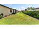 Wide backyard featuring green grass and space for outdoor activities at 9634 Sw 67Th St, Ocala, FL 34481