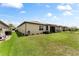Spacious backyard with lush green grass, landscaping, and room for outdoor entertaining at 9634 Sw 67Th St, Ocala, FL 34481