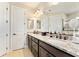 Elegant bathroom with double sinks, granite countertops, and dark wood cabinetry at 9634 Sw 67Th St, Ocala, FL 34481
