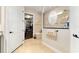 Bright bathroom featuring a glass shower, tile flooring, and an entrance to a walk-in closet at 9634 Sw 67Th St, Ocala, FL 34481