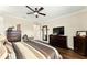 Spacious bedroom with a king-sized bed and dark wood accents at 9634 Sw 67Th St, Ocala, FL 34481