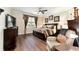 Well-decorated bedroom with a large bed and a dark wood dresser at 9634 Sw 67Th St, Ocala, FL 34481