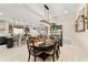 The dining room is open to the kitchen and neutral paint color scheme at 9634 Sw 67Th St, Ocala, FL 34481