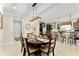 The dining room features an open floor plan to the kitchen, modern chandelier, and neutral paint at 9634 Sw 67Th St, Ocala, FL 34481