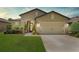 Charming single-Gathering home featuring a well-manicured lawn and a two-car garage at 9634 Sw 67Th St, Ocala, FL 34481