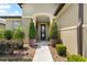 Inviting front entrance with decorative plants, elegant pillars, and a well-maintained walkway at 9634 Sw 67Th St, Ocala, FL 34481