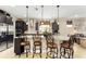 Kitchen with granite countertops, island with barstools, and stainless steel appliances at 9634 Sw 67Th St, Ocala, FL 34481