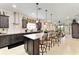 Spacious kitchen featuring a large island with seating, stainless steel appliances and ample counter space at 9634 Sw 67Th St, Ocala, FL 34481