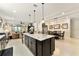 Bright open kitchen and dining area with island and modern cabinetry at 9634 Sw 67Th St, Ocala, FL 34481