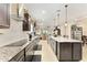 Stylish kitchen with granite countertops, modern appliances, and adjacent dining area at 9634 Sw 67Th St, Ocala, FL 34481