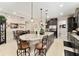 Kitchen with granite countertops, island with seating, and open layout to the dining area at 9634 Sw 67Th St, Ocala, FL 34481