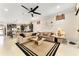 Comfortable living room featuring an open floor plan and a stylish ceiling fan at 9634 Sw 67Th St, Ocala, FL 34481