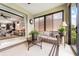 Bright sunroom connected to the main living area with a relaxing seating area at 9634 Sw 67Th St, Ocala, FL 34481