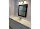 The bathroom sink with white cabinets and modern lighting is highlighted in this image at 9711 Sw 97Th Pl, Ocala, FL 34481