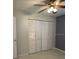 Bedroom features a spacious closet with white doors, white baseboards and tile floor at 9711 Sw 97Th Pl, Ocala, FL 34481