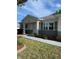 Well-maintained single-story home with charming front entrance and landscaped front yard at 9711 Sw 97Th Pl, Ocala, FL 34481