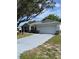 Charming single-story home showcasing a two-car garage and well-manicured landscaping at 9711 Sw 97Th Pl, Ocala, FL 34481