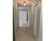 Hallway with tile flooring leading to front door and featuring a closet for storage at 9711 Sw 97Th Pl, Ocala, FL 34481