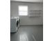 The laundry room is equipped with a washing machine and dryer at 9711 Sw 97Th Pl, Ocala, FL 34481