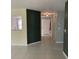 Spacious open-concept living room with tile flooring leading to the hallway and kitchen at 9711 Sw 97Th Pl, Ocala, FL 34481