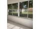 Enclosed patio with open windows providing lots of light and view of the yard at 9711 Sw 97Th Pl, Ocala, FL 34481