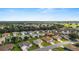 Aerial view of a residential community with lush landscaping and nearby amenities at 13100 Se 93Rd Terrace Rd, Summerfield, FL 34491