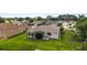 Aerial view of a well-kept backyard with a screened-in porch and green lawn at 13100 Se 93Rd Terrace Rd, Summerfield, FL 34491