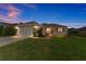 Charming single-story home with a well-maintained lawn and attached two-car garage at 13100 Se 93Rd Terrace Rd, Summerfield, FL 34491