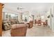 Bright living area with neutral carpeting, a ceiling fan, and a dining area at 13100 Se 93Rd Terrace Rd, Summerfield, FL 34491