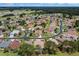 Aerial view showcasing the neighborhood's lush greenery, curved streets, and well-spaced homes at 15776 Sw 11Th Terrace Rd, Ocala, FL 34473