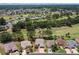 Panoramic aerial view of the community and home in a verdant setting near the golf course at 15776 Sw 11Th Terrace Rd, Ocala, FL 34473