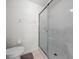 Clean bathroom featuring a shower with sliding glass door and modern fixtures at 15776 Sw 11Th Terrace Rd, Ocala, FL 34473