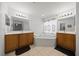 A bathroom featuring double sinks, a corner tub, modern lighting, and tile flooring at 15776 Sw 11Th Terrace Rd, Ocala, FL 34473