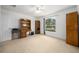 Spacious bedroom with window offering scenic views, carpet and white trim at 15776 Sw 11Th Terrace Rd, Ocala, FL 34473